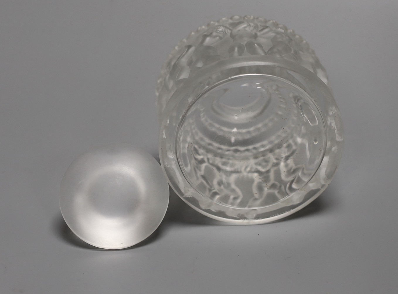 A Lalique Les Enfants pattern glass jar and cover. 30cm tall